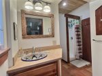 Bathroom accessible by both sides of the house, adjacent to loft, living area and kitchen.